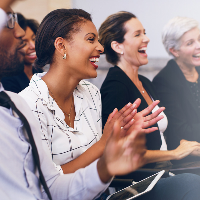 group of business people clapping