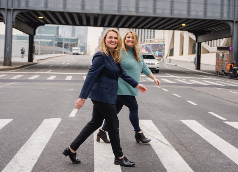 Dan'l and Megan walking across a crosswalk